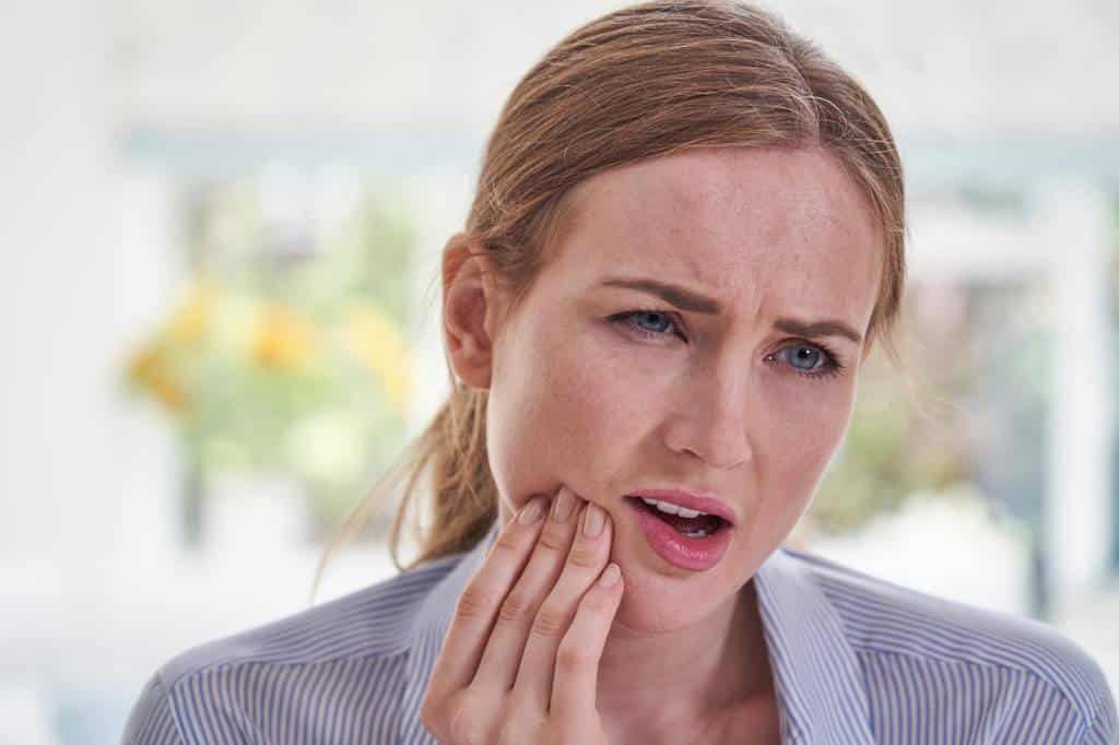 TRU Dentistry Austin, Woman in pain from grinding teeth can ease pain with botox, TRU Dentistry Austin, TRU Dentistry, South Austin botox dentist, botox, TMD, jaw pain, TMJ treatment, dental crowns, tooth pain